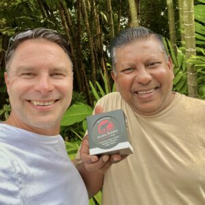 Mark from AromaHoliday and guide Sanjha smiling with an aromas of Sri Lanka candle