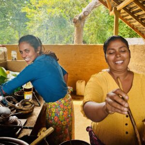 Local women cooking traditional spiced foods made to laugh by Mark on his adventures to capture the Aromas of Sri Lanka